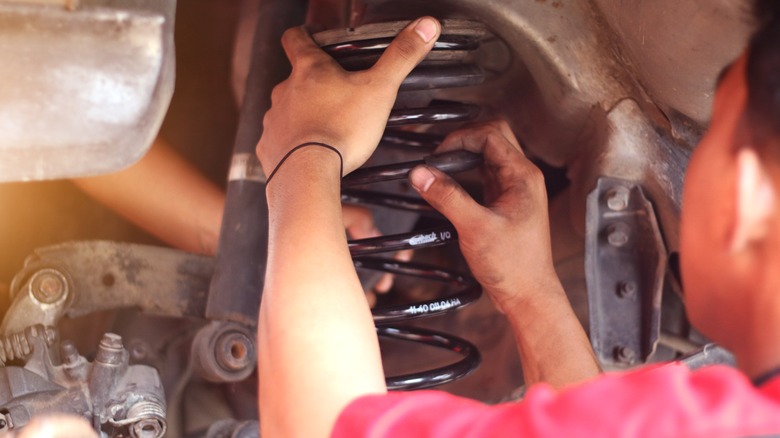 Person repairing car