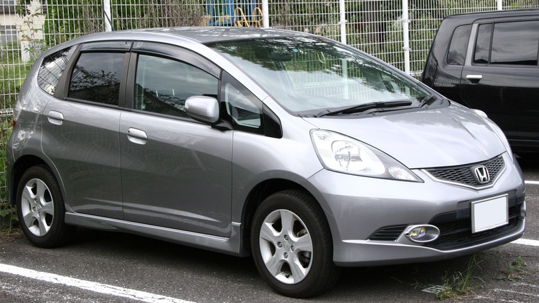 A silver 2010 Honda Fit