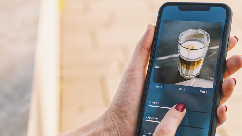 Person editing photo on phone