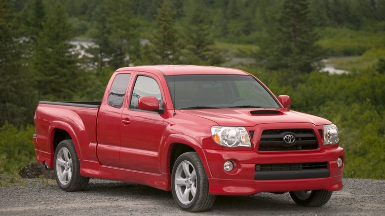 Red 2005 Toyota Tacoma X-Runner parked on dirt