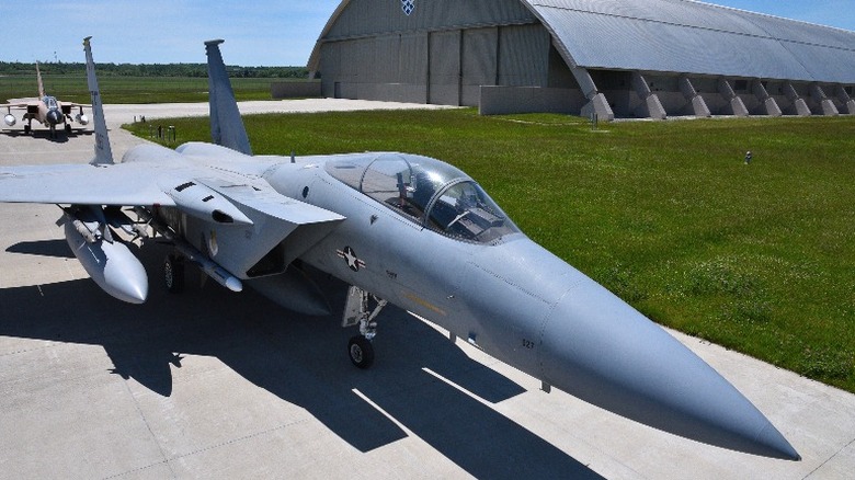 F-15 Eagle in front of a hanger