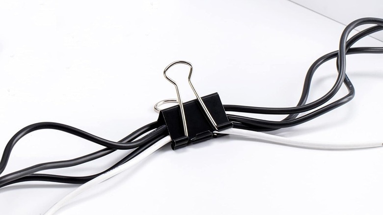 Binder clip being used to group cables together.