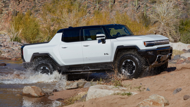 GMC Hummer EV driving through water