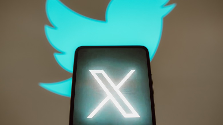 New X logo with Twitter logo in background