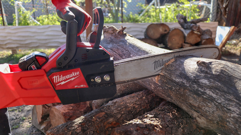 cutting firewood with Milwaukee chainsaw
