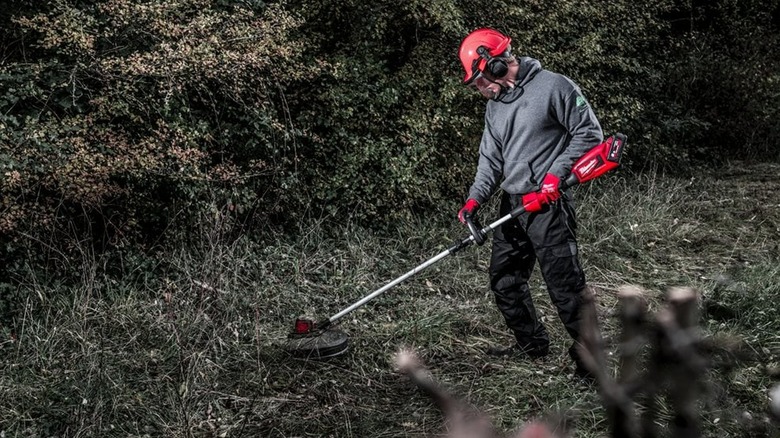 Using M18 string trimmer