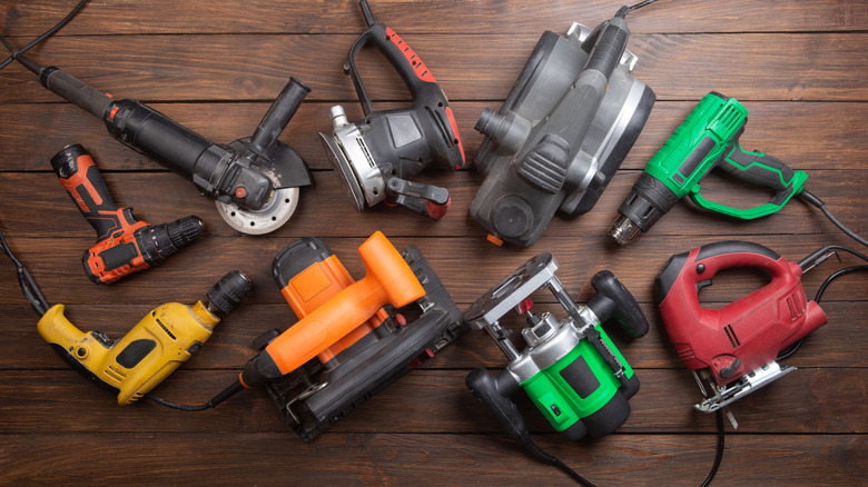 Electric tools set on a wooden table