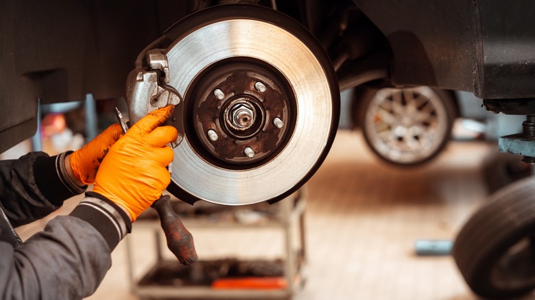 Working on the brakes of a car