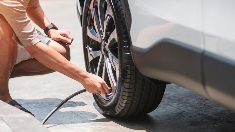 Person inflating tire