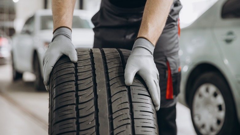 Person rolling tire