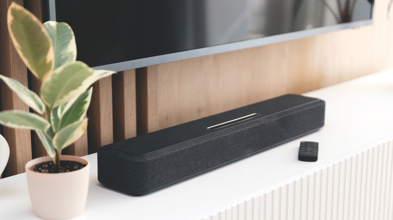 A TV surrounded by left, right and center speakers.