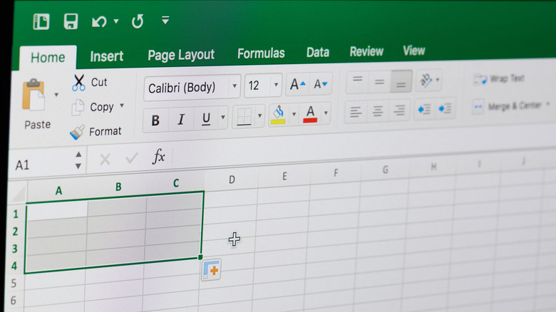 Microsoft Excel software on screen showing blank spreadsheet