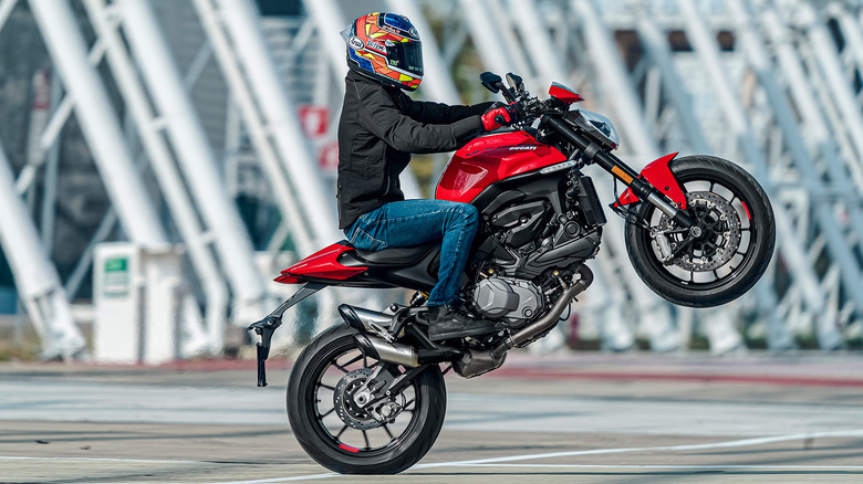 Ducati monster rider doing a wheelie