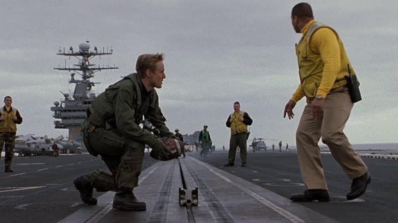 Kicking a football with aircraft carrier