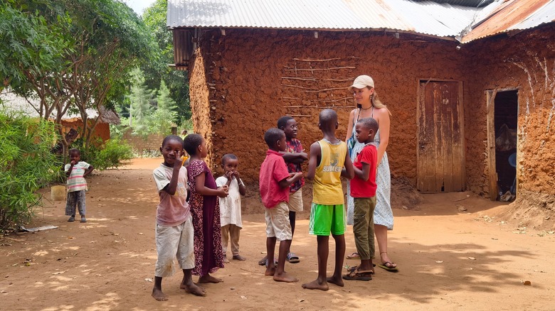 A backpacker volunteering in Africa.