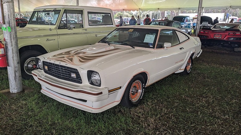 White Ford Mustang King Cobra at car show