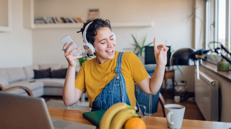 girl talking on phone headphones