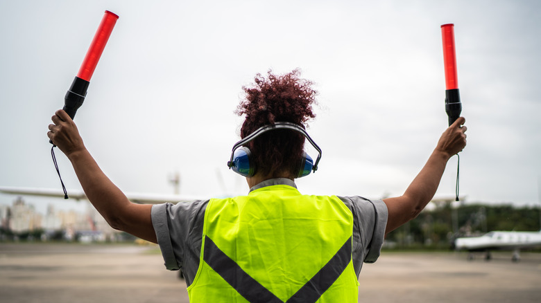 earmuffs on aircraft marshaller