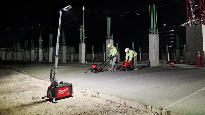 Milwaukee tower light shining on workers