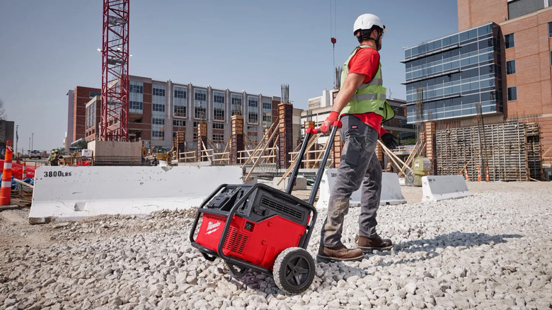 Person pulling Milwaukee Power Supply around job site