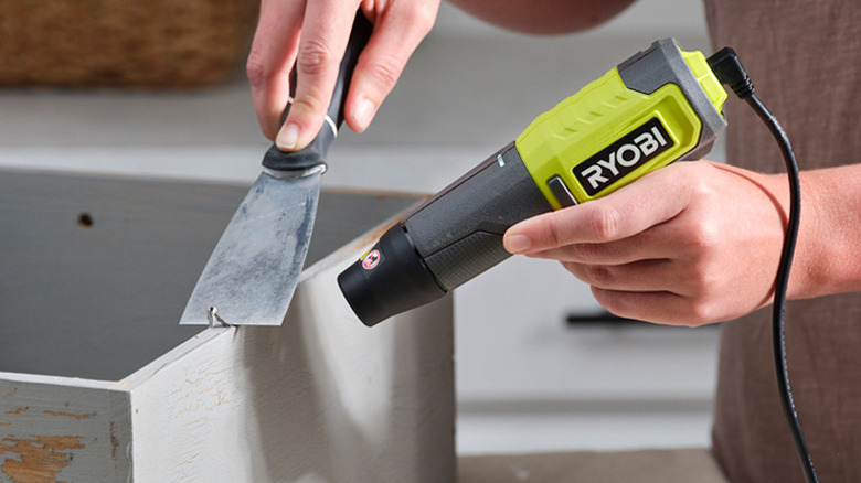 metal scraper tool and a Ryobi Heat Pen