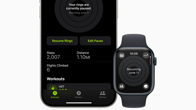 Apple Watch and iPhone showing paused activity rings