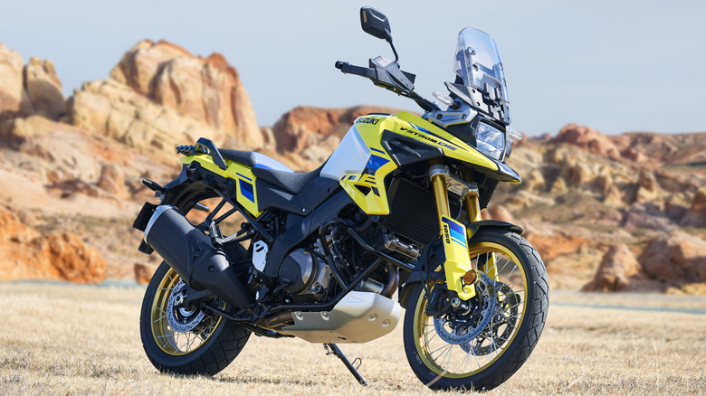 Yellow Suzuki V-Strom 1050DE Adventure parked on grass