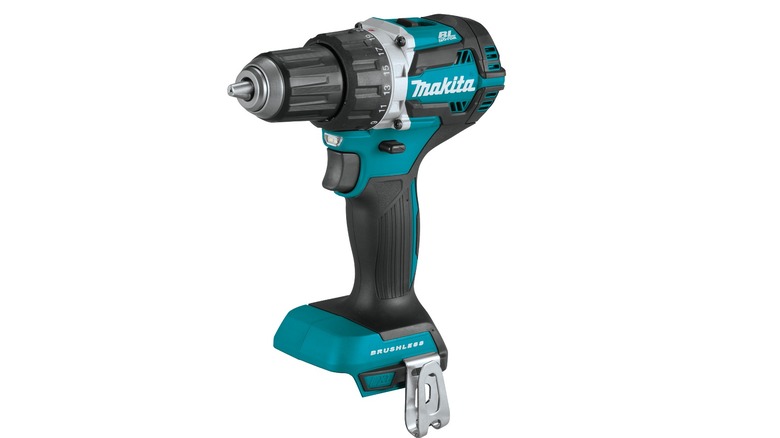 Makita drill drilling into metal bar