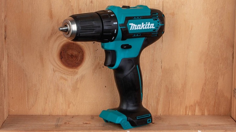 Makita drill resting on shelf