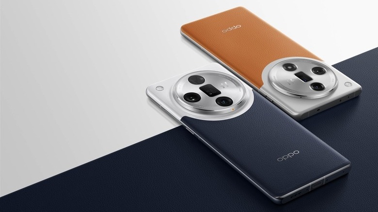 Oppo Find X7 Ultra in orange and blue resting on a table