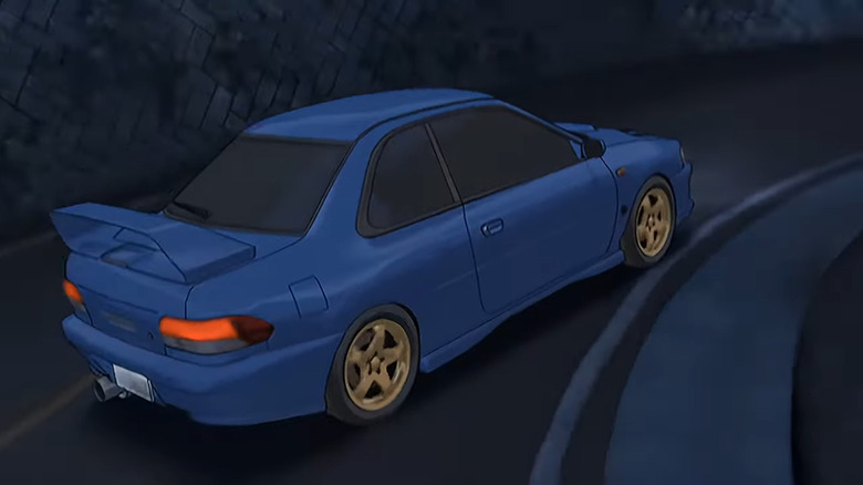 Subaru Impreza racing down road