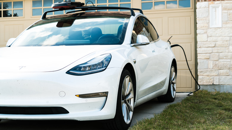 Tesla parked at home closeup