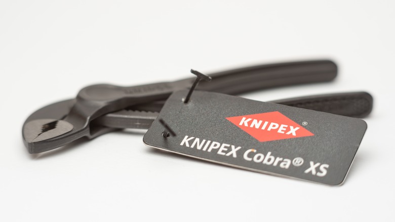 Single Knipex wrench with a branded tag