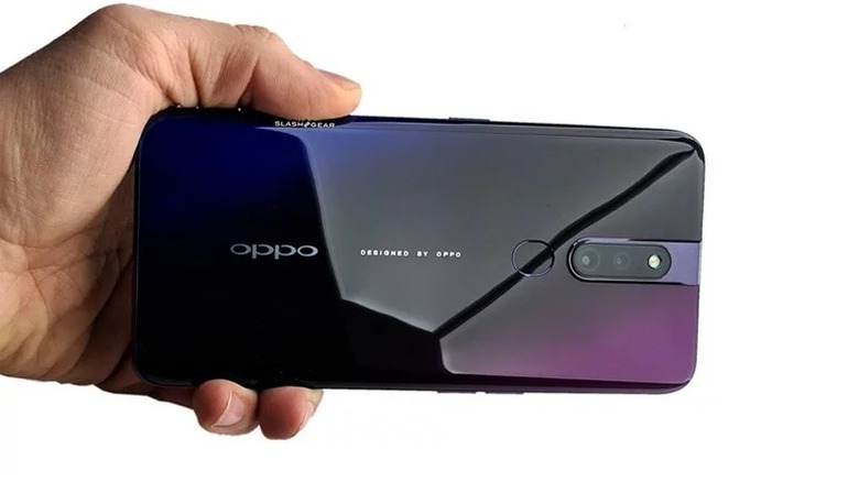 Hand holding OPPO F11 Pro 