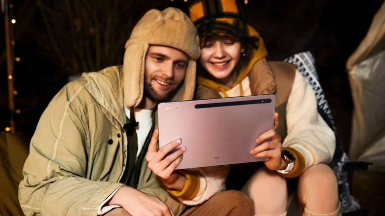 two people holding samsung galaxy tab s8+