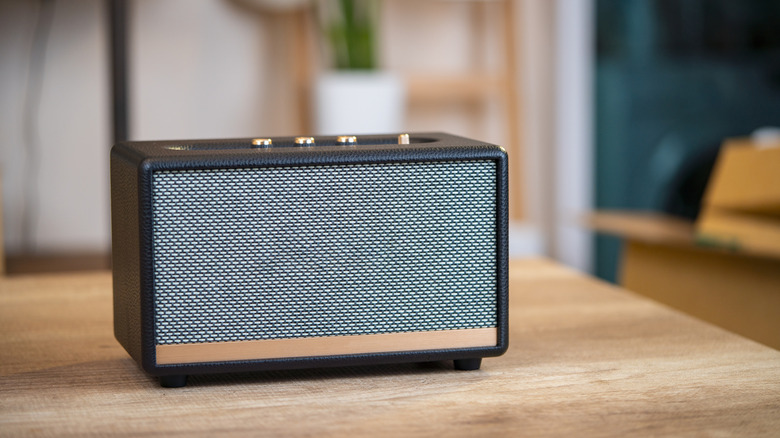 A Marshall speaker kept on a wooden table