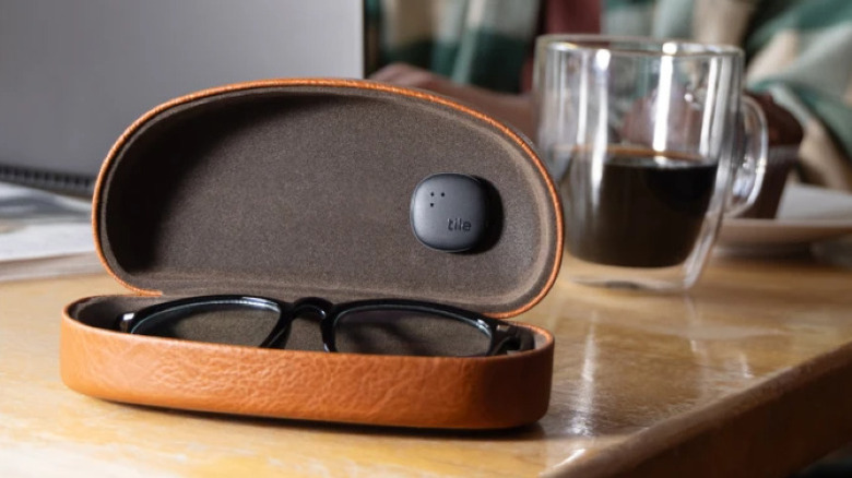 Tile Sticker affixed inside a glasses case on a table