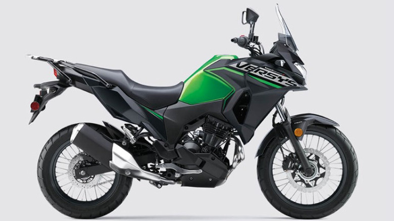 Kawasaki Versys-X 300 motorcycle in black and green on display