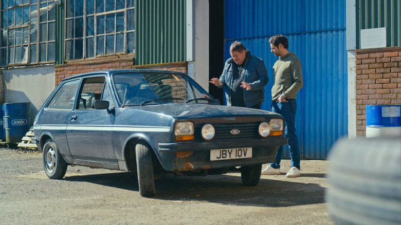 Men admiring car