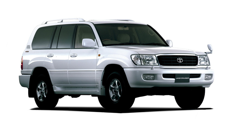 White Toyota Land Cruiser 100 on white background front 3/4 view