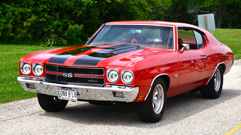 A red 1970 Chevelle with black race stripes