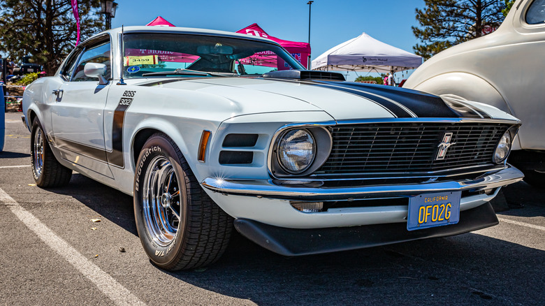 A 1969/1970 Ford Mustang Boss 302 in white, front 3/4 view