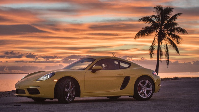 Porsche 718 Cayman yellow color at sunset