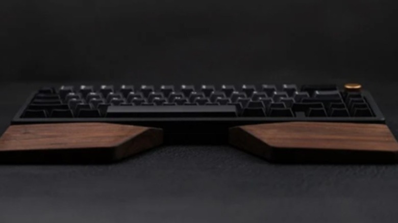 Brown wood keyboard wrist rest with a black computer keyboard