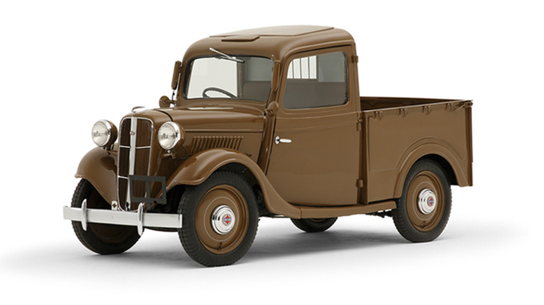 A Datsun 17T Pickup in brown against a white background