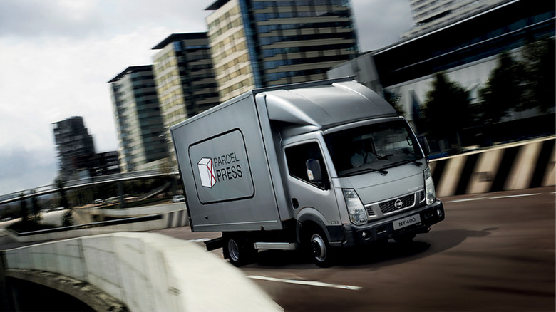 A Nissan NT400 driving on a highway