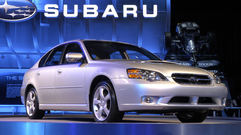 A silver fourth generation Subaru Legacy at an auto show, front 3/4 view