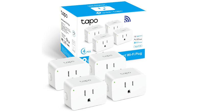 Set of 4 TP-Link smart plugs with their packaging