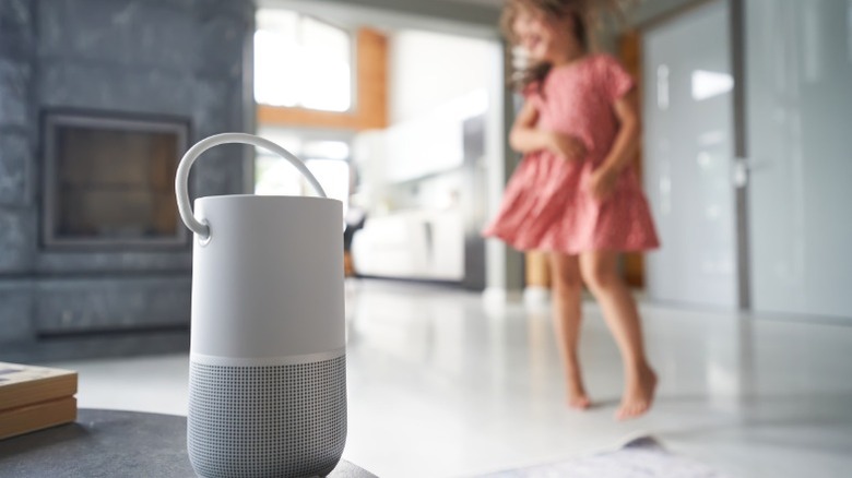 a girl and a smart speaker