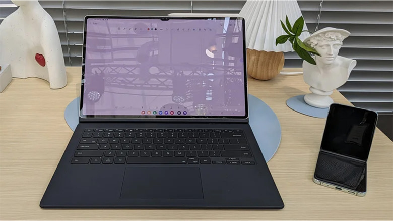 A Galaxy Tab S9 attached to a keyboard on a desk